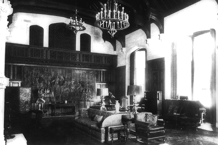 The mansion's classical interior reflects elaborate Tudor features and heavy Italianate carvings, as typified by the grand, three-story music room, added in 1925.